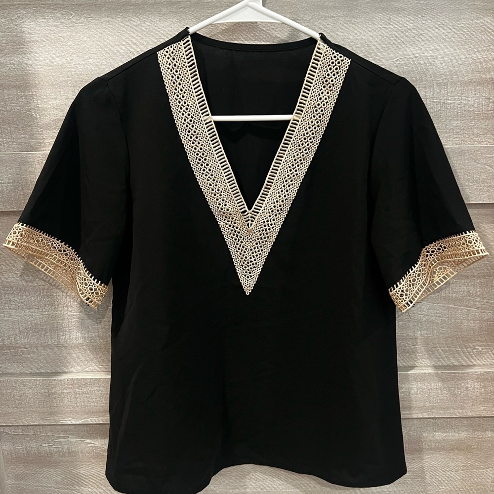 Elegant Black V-Neck Top with Cream Accents